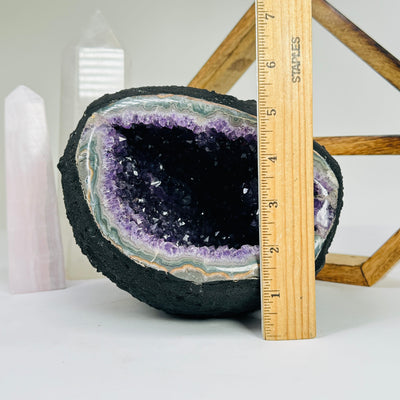 amethyst cathedral next to a ruler for size reference