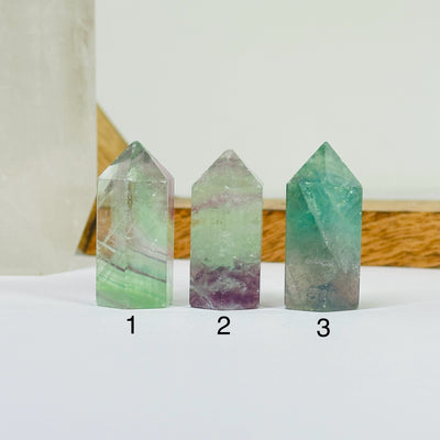 fluorite points with decorations in the background