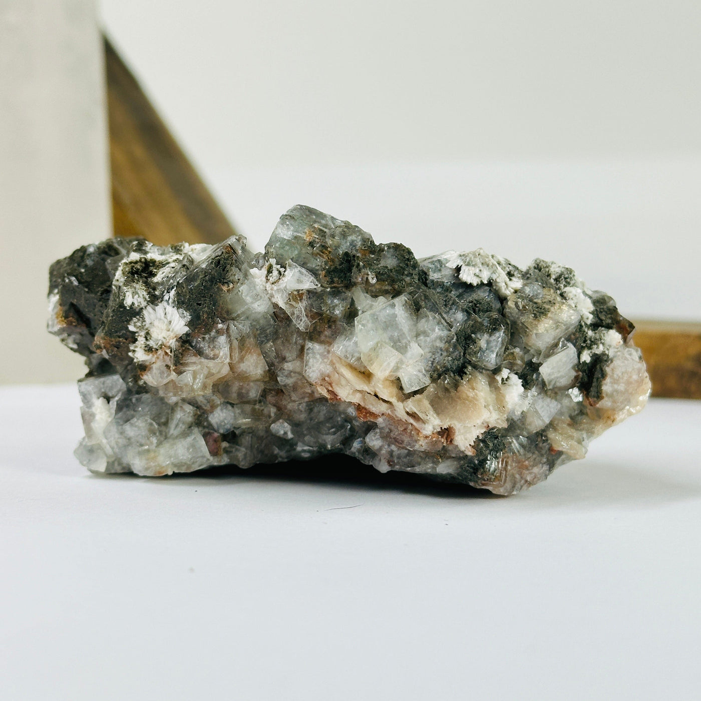 zeolite with stilbite with decorations in the background