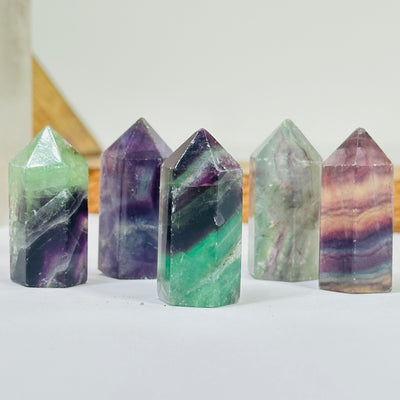 fluorite points with decorations in the background