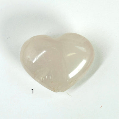 rose quartz heart on white background