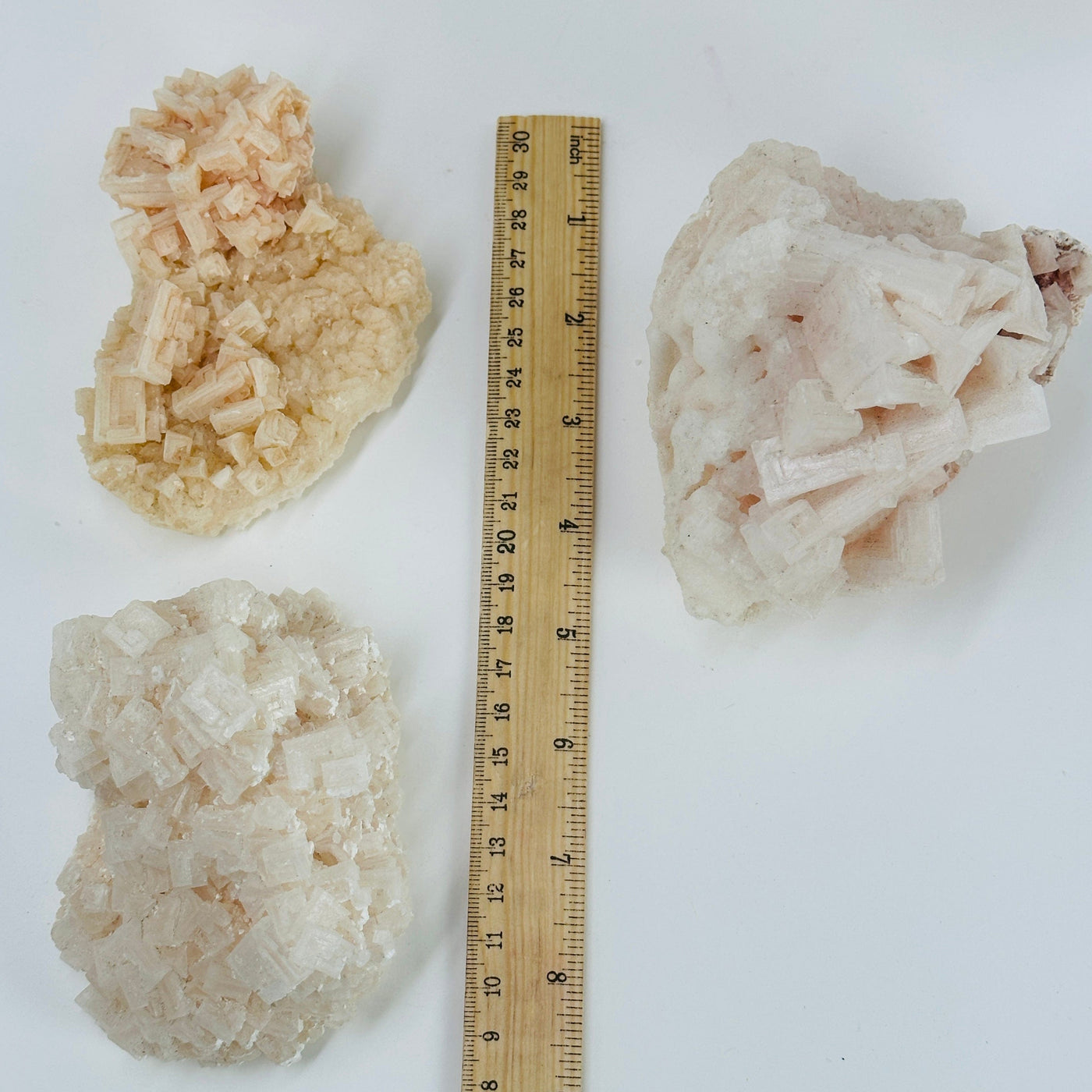 halite clusters next to a ruler for size reference