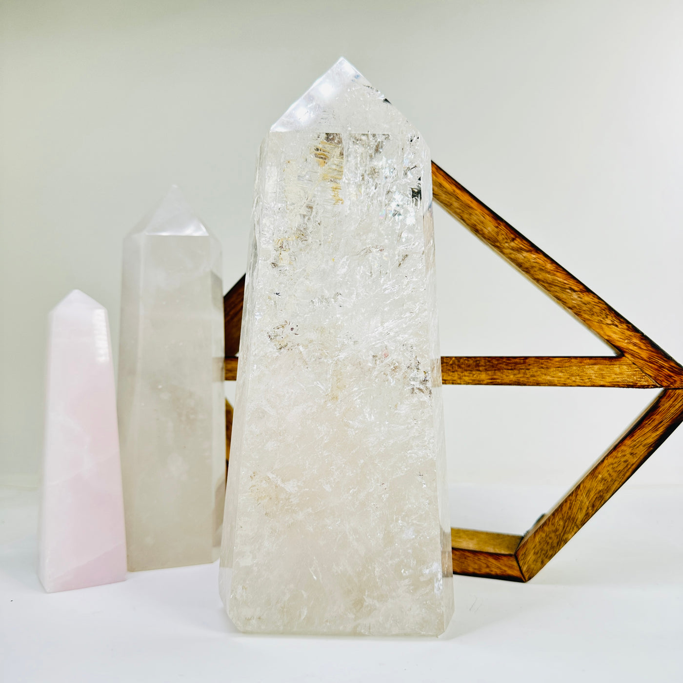 crystal quartz point with decorations in the background