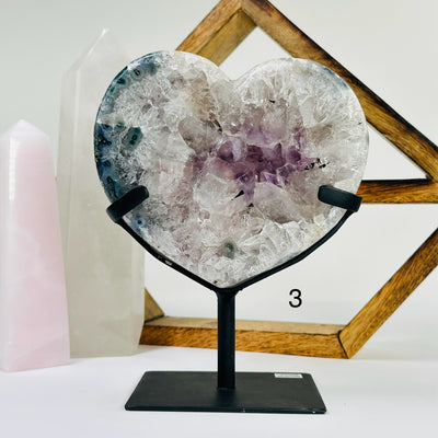 amethyst HEART with decorations in the background