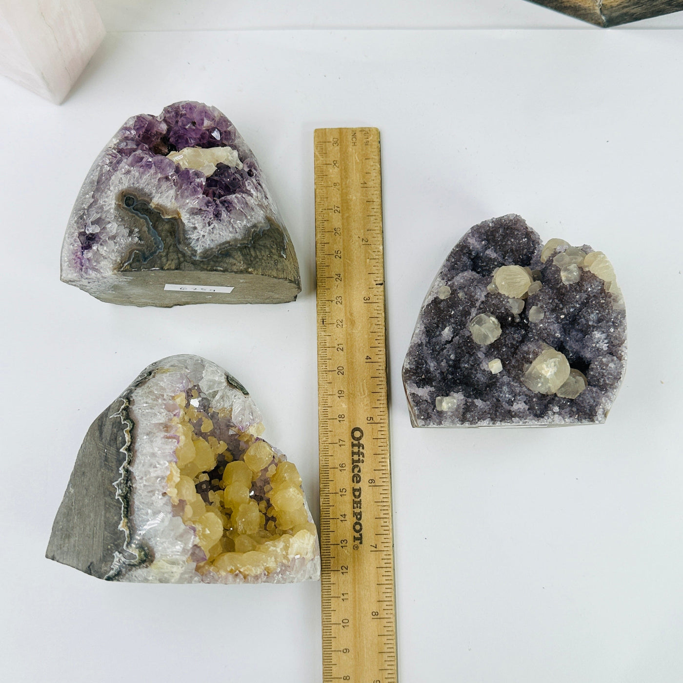 amethyst cut base next to a ruler for size reference