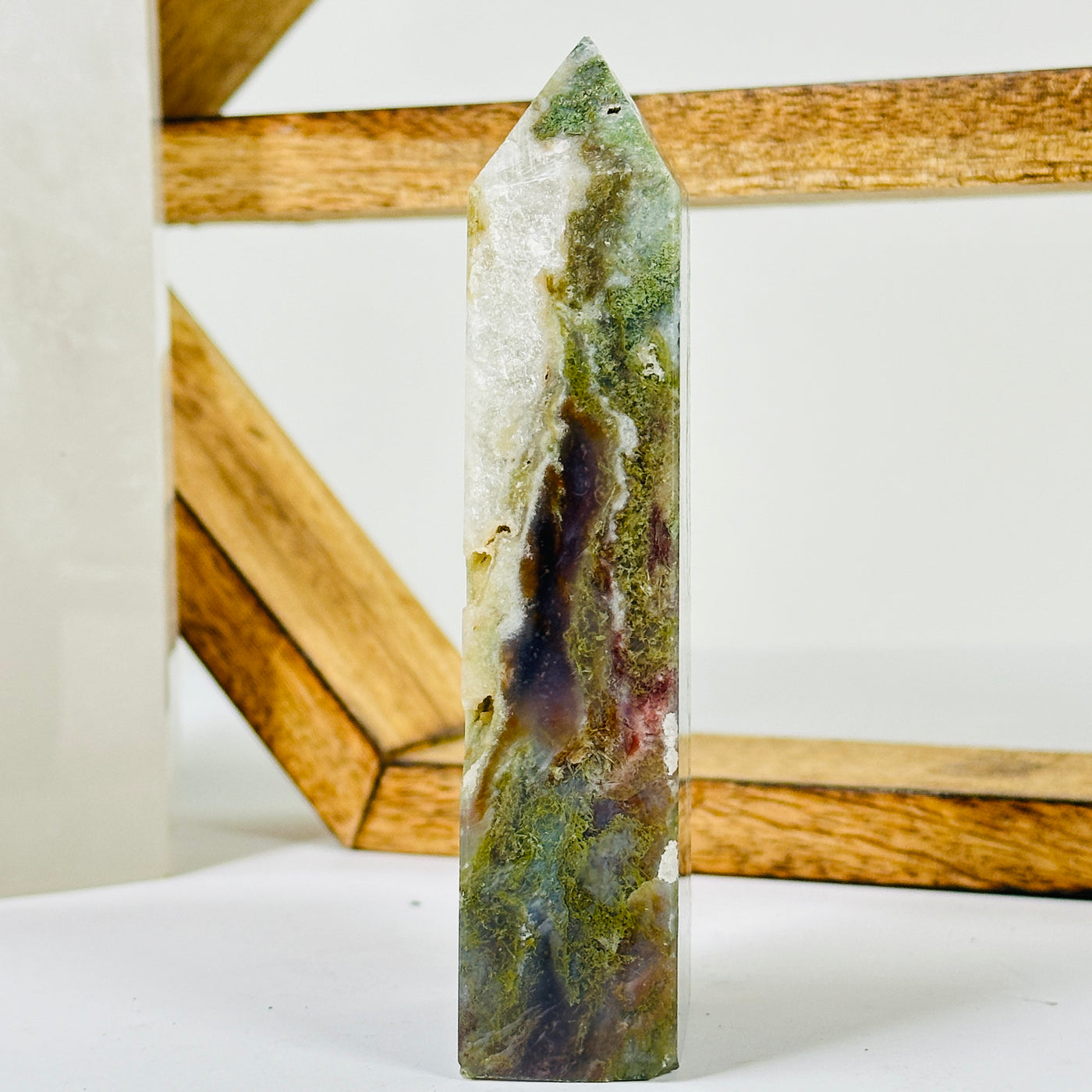 moss agate with decorations in the background