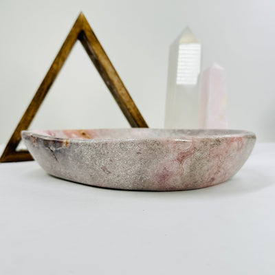 pink amethyst bowl with decorations in the background