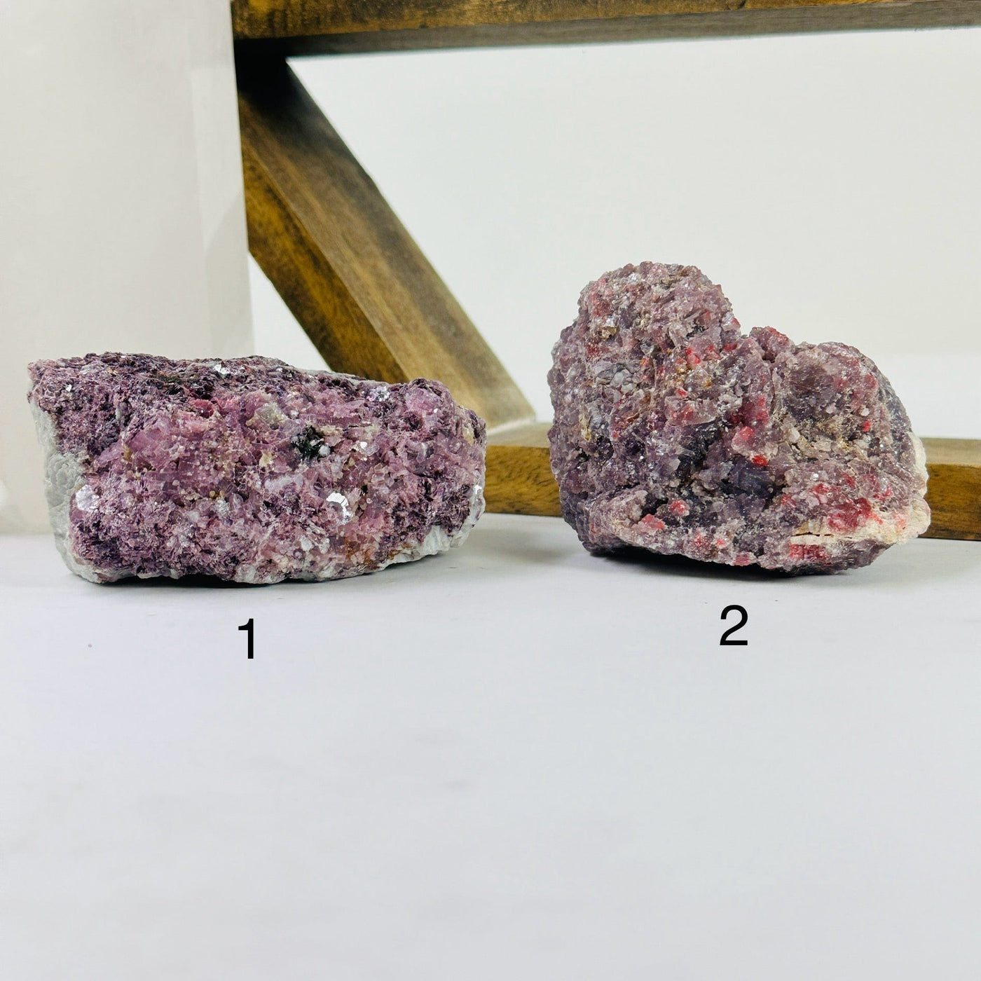 lepidolite cluster with decorations in the background