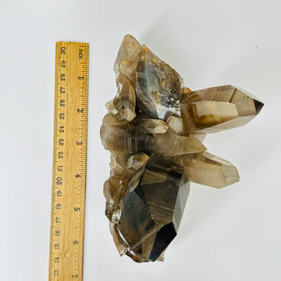 smokey quartz with decorations in  the background