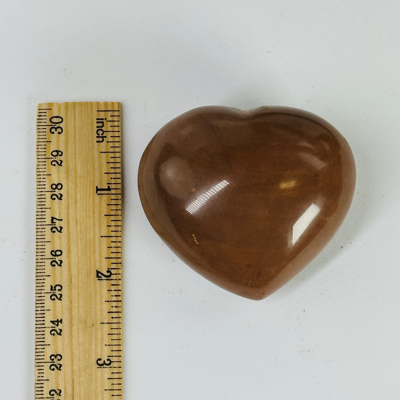 jasper heart next to a ruler for size reference