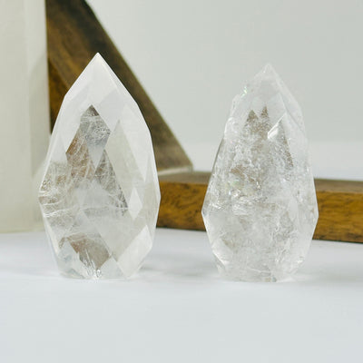 crystal quartz point with decorations in the background