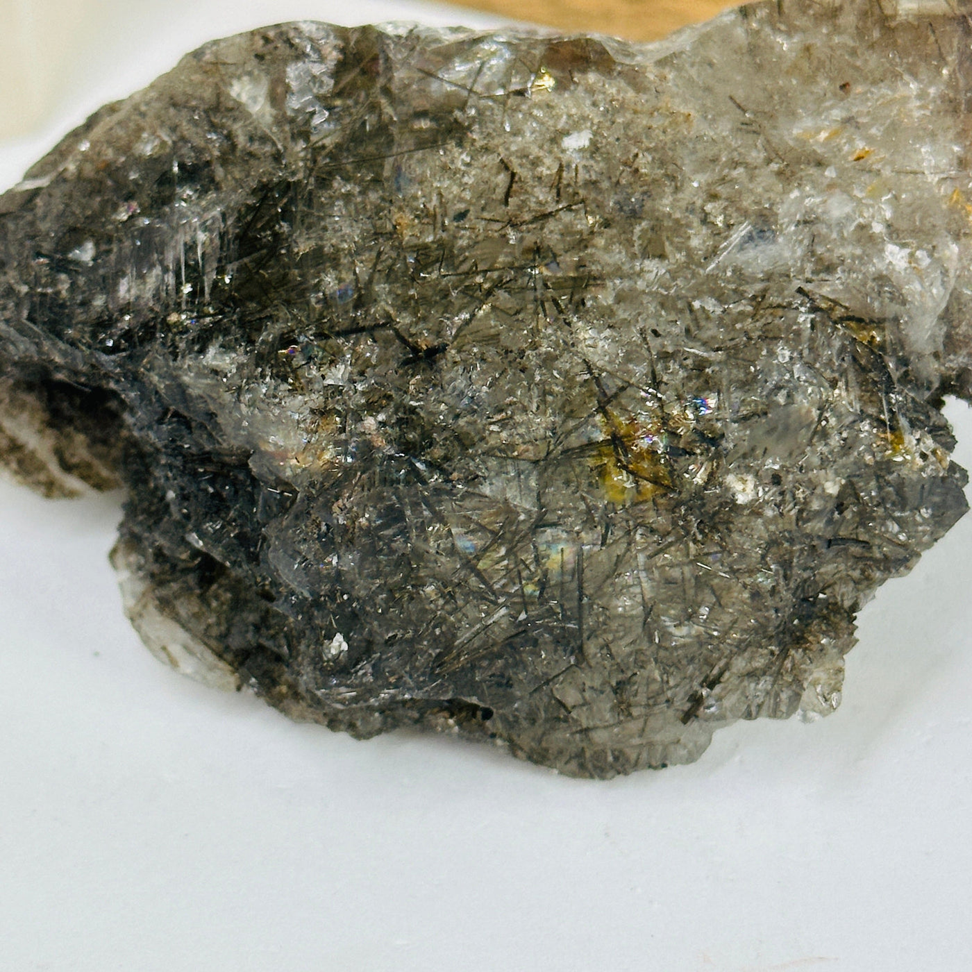 rutile quartz with decorations in the background