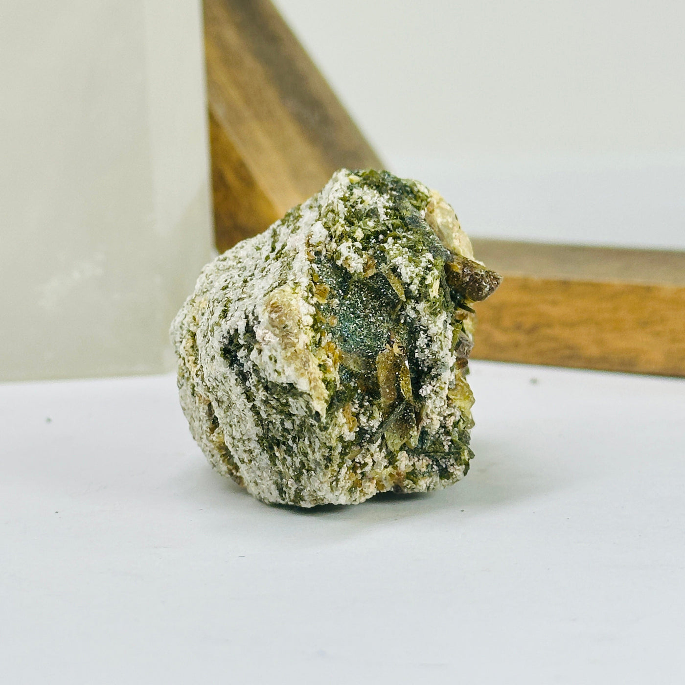 rutile quartz with decorations in the background