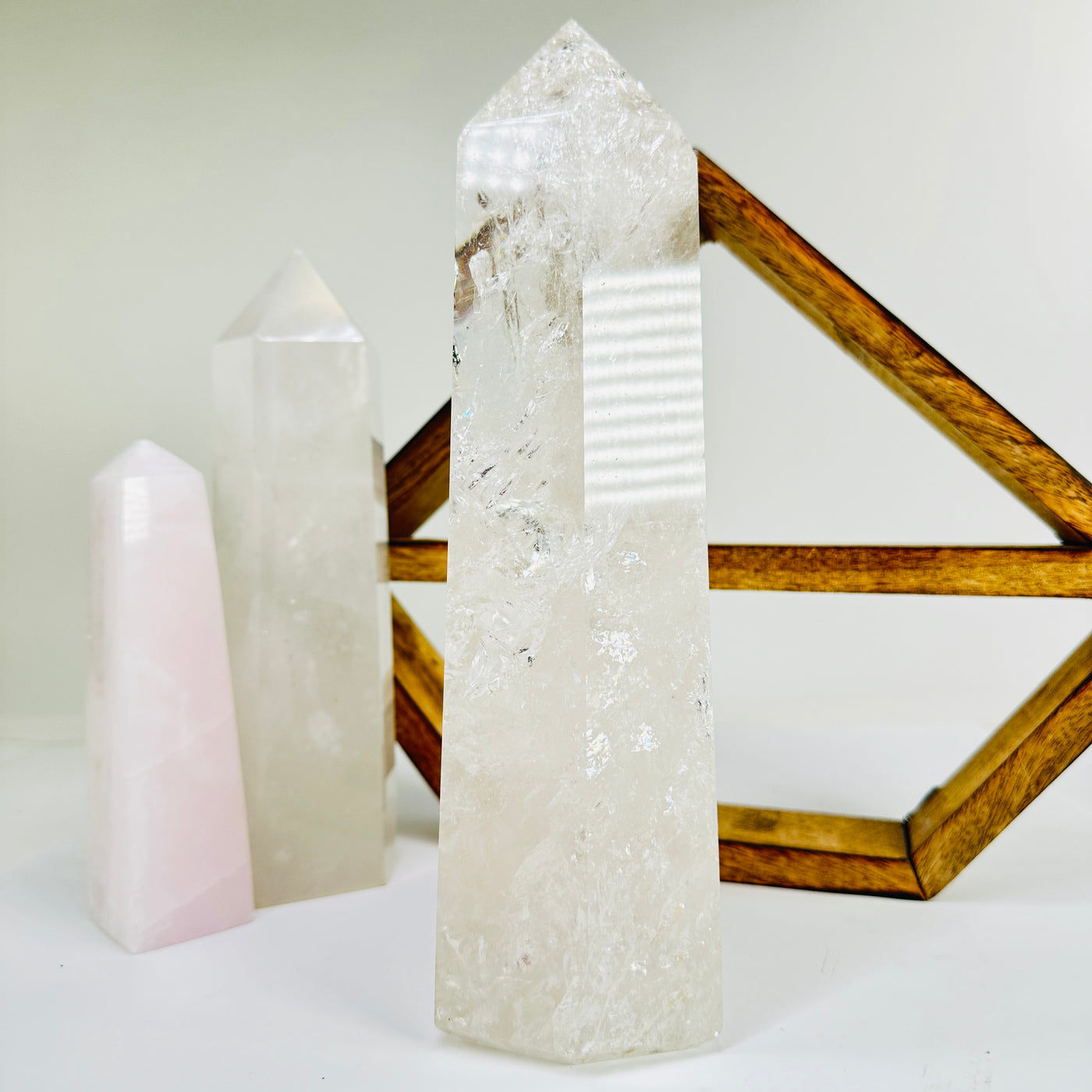 crystal quartz point with decorations in the background