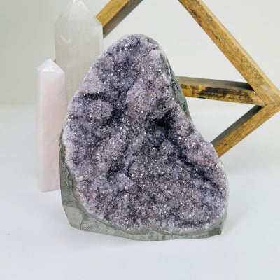 amethyst cut base with decorations in the background