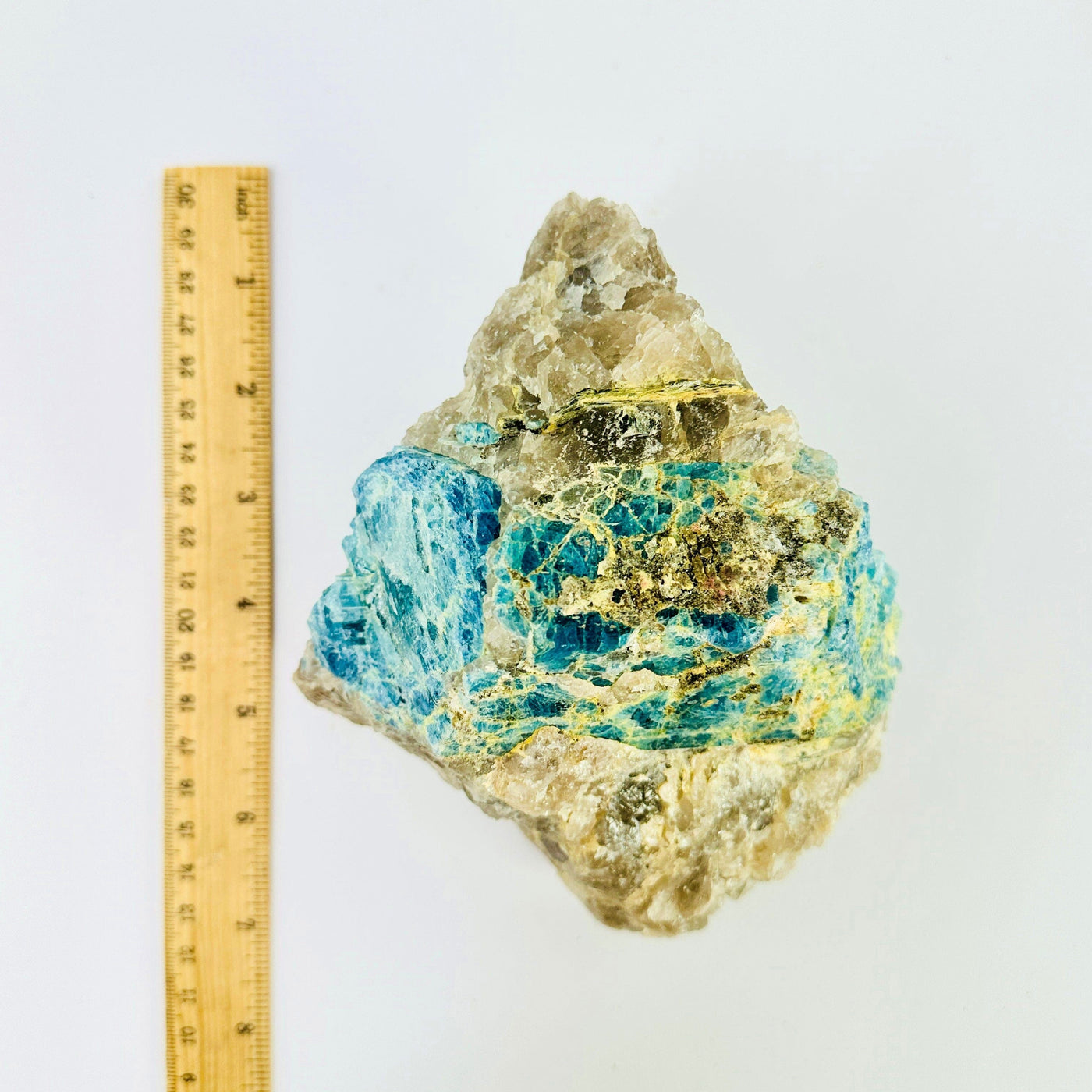Aquamarine in matrix - natural rough stone next to ruler for size reference