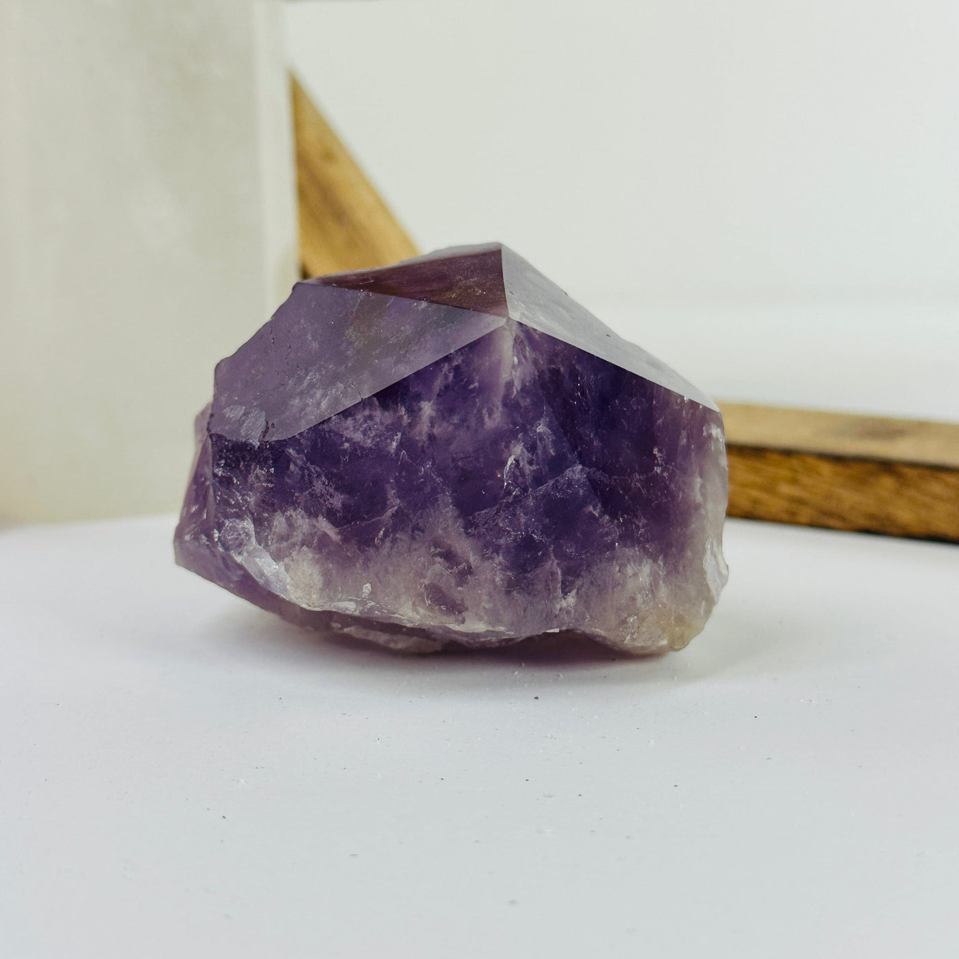amethyst point with decorations in the background