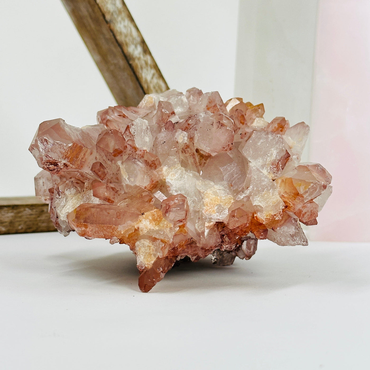 lithium quartz cluster with decorations in the background