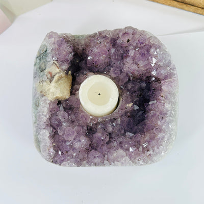 amethyst candle holder with decorations in the background