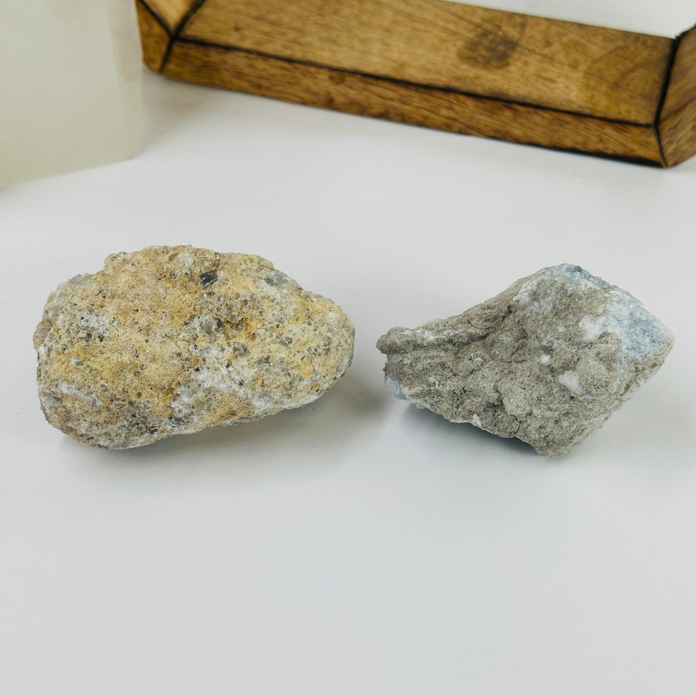 CELESTITE CLUSTERS with decorations in the background