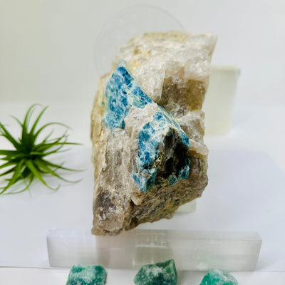 Aquamarine in matrix - giant aquamarine crystal embedded in large natural rough stone side view
