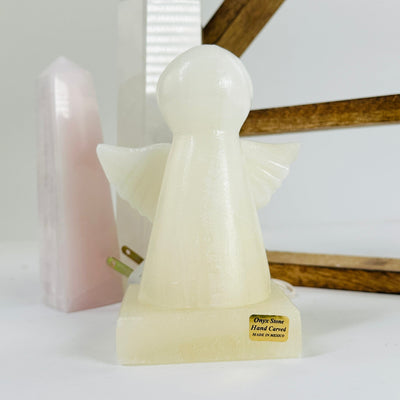 onyx angel lamp with decorations in the background