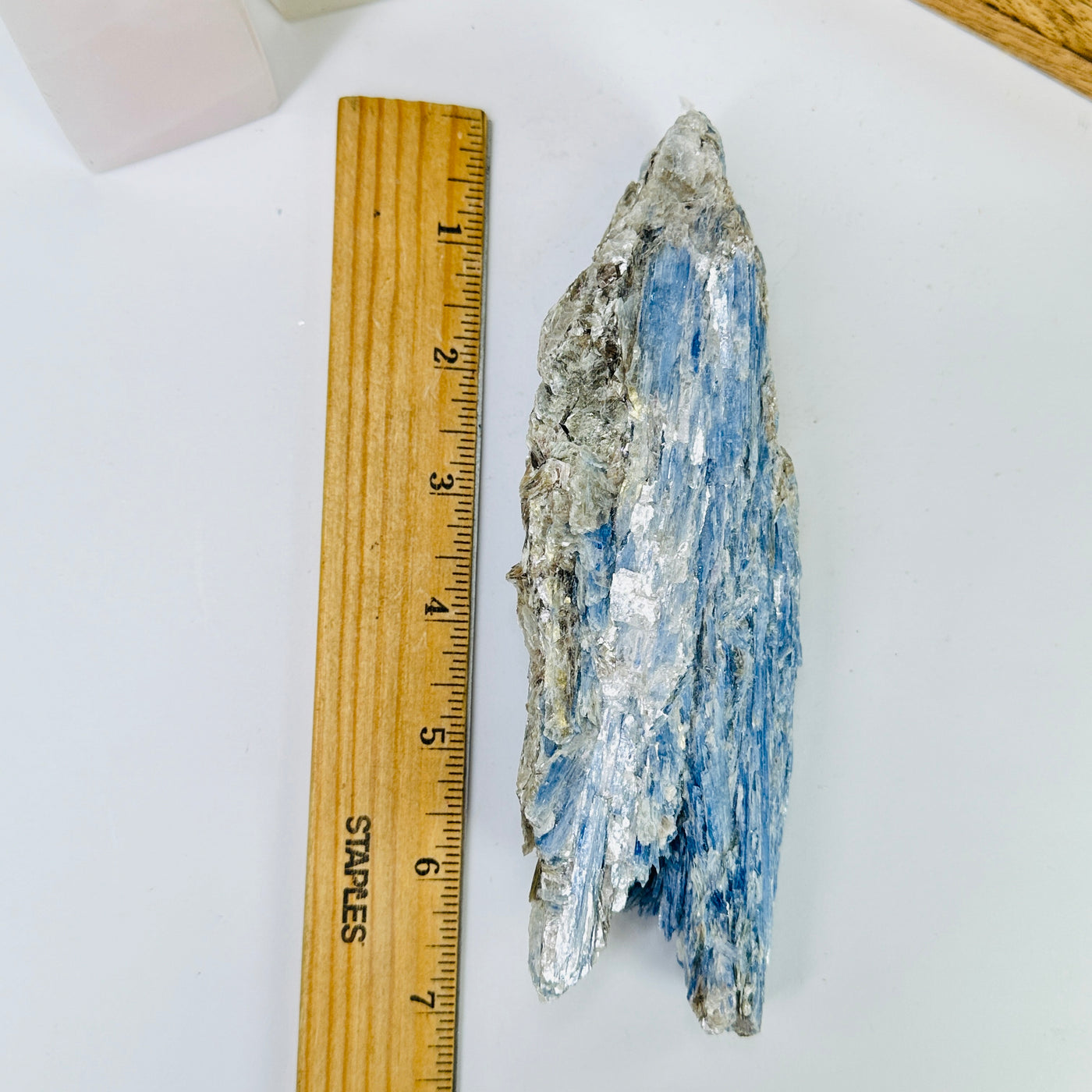 kyanite next to a ruler for size reference