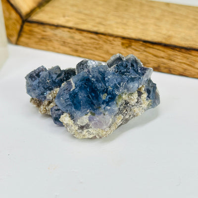 blue fluorite with decorations in the background