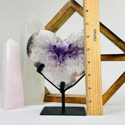 amethyst HEART next to a ruler for size reference