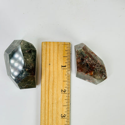 garden quartz next to a ruler for size reference