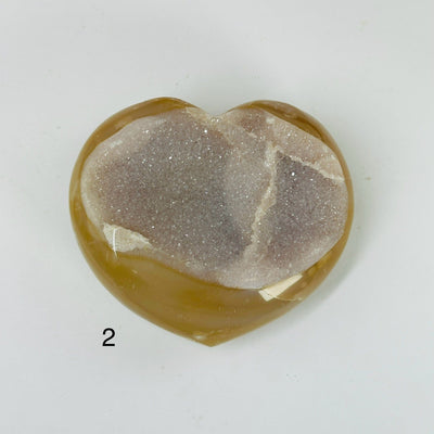 agate heart with decorations in the background