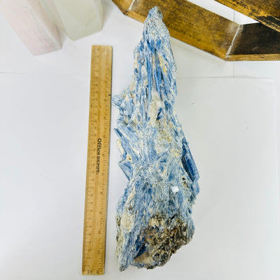 kyanite next to a ruler for size reference