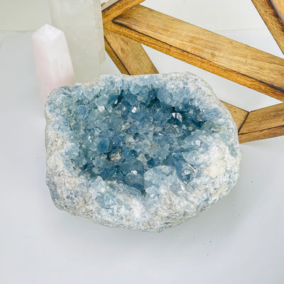 Celestite with decorations in the background