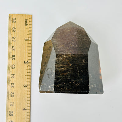 rutile quartz with decorations in the background