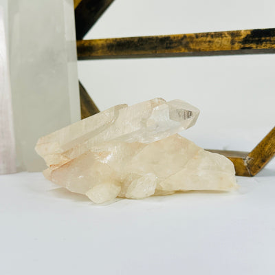 lemurian tangerine quartz with decorations in the background