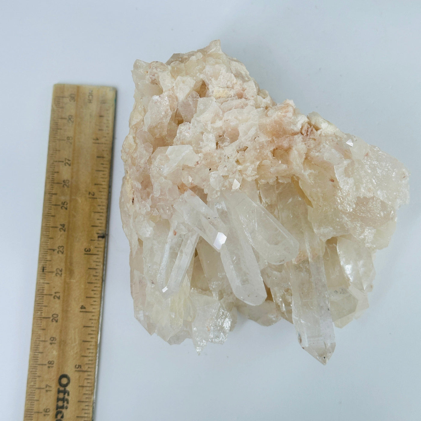 lemurian tangerine quartz next to a ruler for size reference