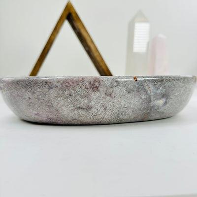 pink amethyst bowl with decorations in the background