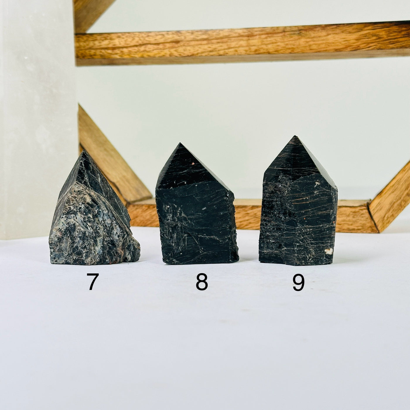 tourmaline points with decorations in the background