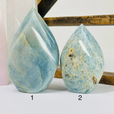 aquamarine points with decorations in the background