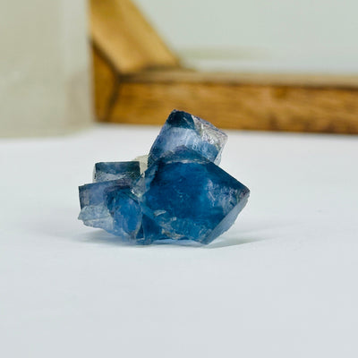 blue fluorite with decorations in the background