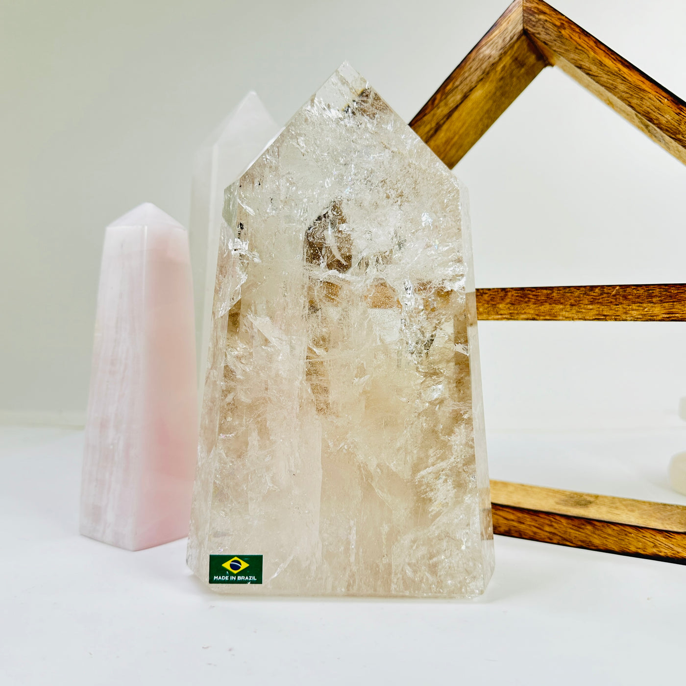 crystal quartz point with decorations in the background