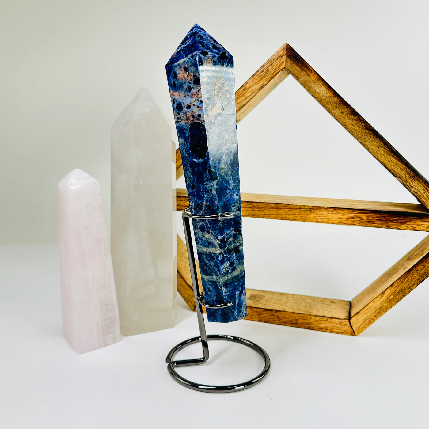 sodalite wand with decorations in the background