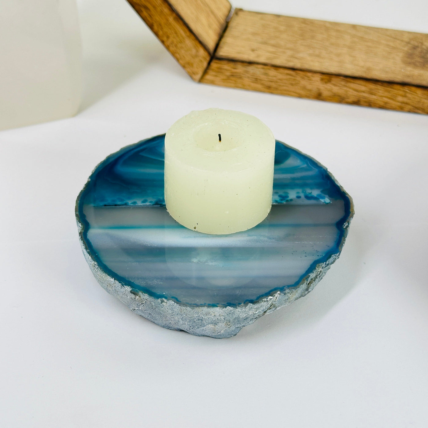 teal agate coaster with decorations in the background