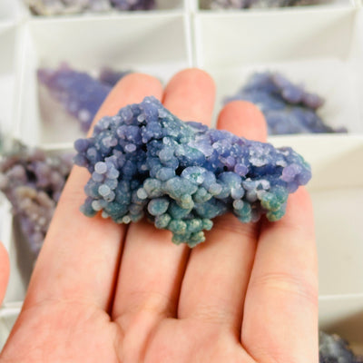 Grape agate with decorations in the background