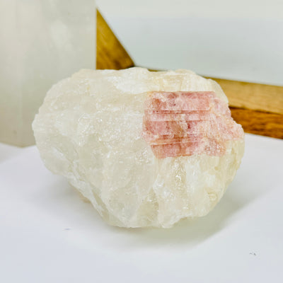 tourmaline with decorations in the background