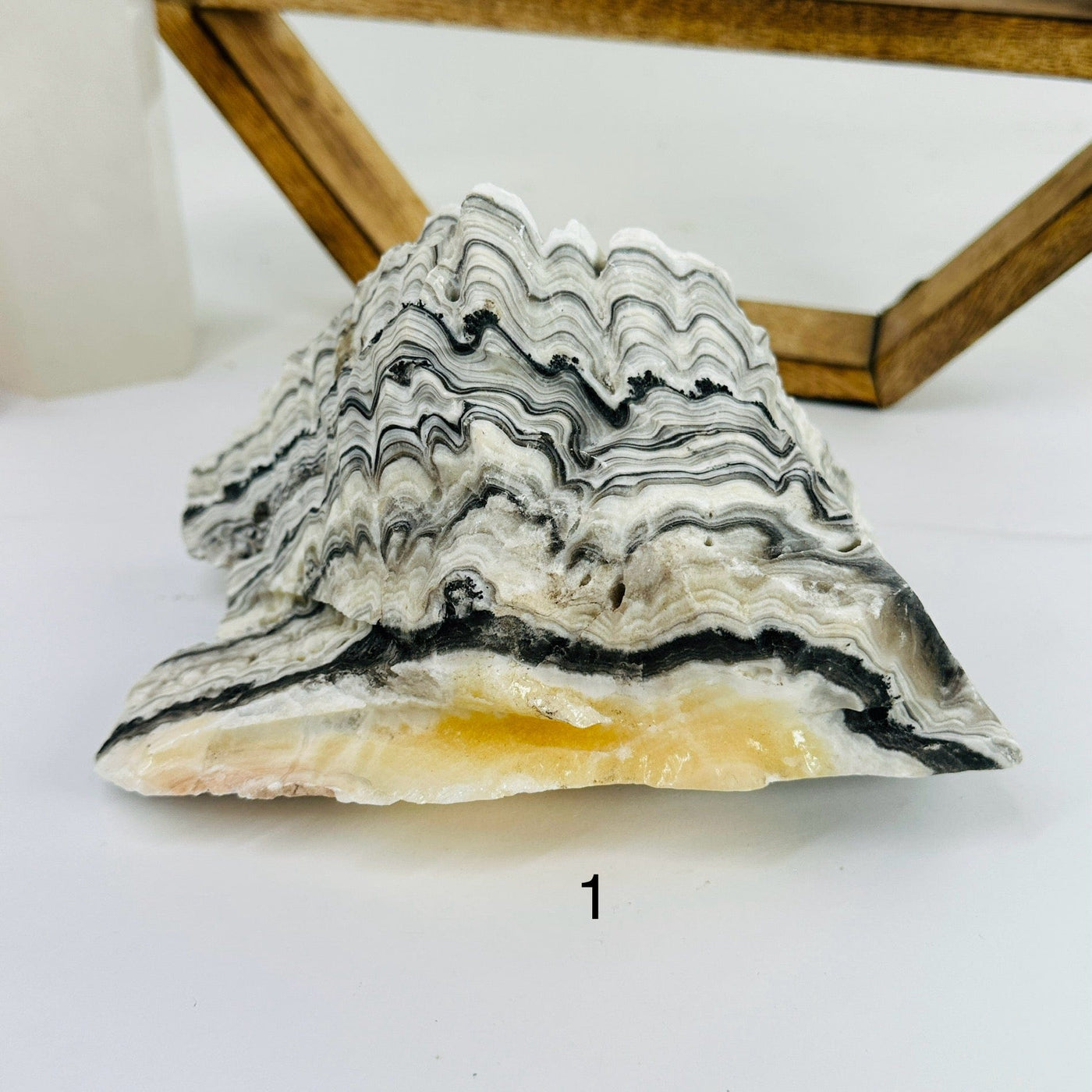 Mexican onyx cluster with decorations in the background