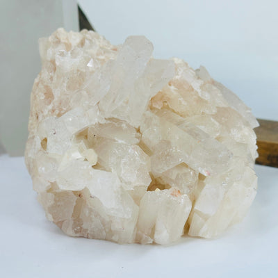 lemurian tangerine quartz with decorations in the background