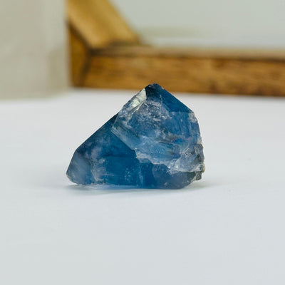 blue fluorite with decorations in the background