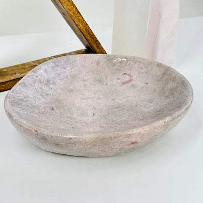 pink amethyst bowl with decorations in the background