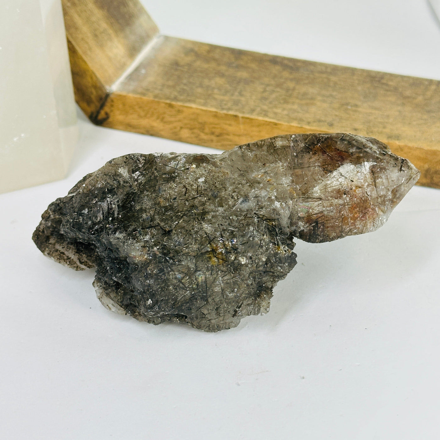 rutile quartz with decorations in the background